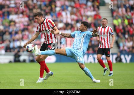 Sunderland's Ross Stewart is fouled by Coventry City's Gustavo Hamer during the Sky Bet Championship match between Sunderland and Coventry City at the Stadium Of Light, Sunderland on Sunday 31st July 2022. (Credit: Michael Driver | MI News) Stock Photo