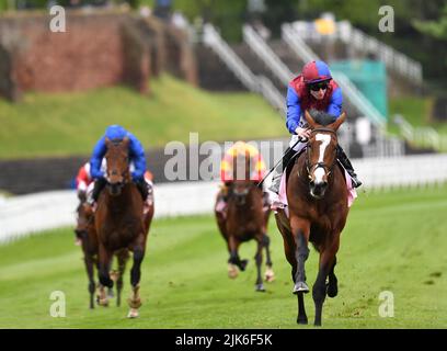 Changingoftheguard and Ryan Moore winners of the Chester Vase from the odds on New London (blue) left. Chester UK 4th May 2022. ©George Selwyn Stock Photo