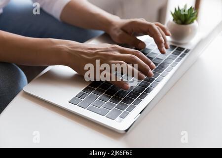 Young freelancer woman working at computer at home, using laptop Stock Photo