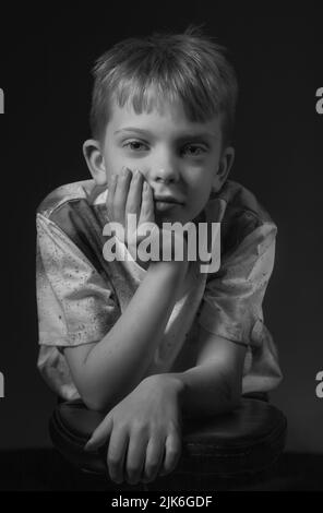 Young boy in studio pose Stock Photo