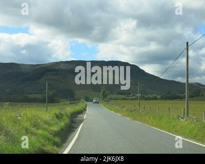 The very scenic A924 winds its way through the river valley of Strathardle with stunning moorland and glen scenery between Blairgowrie and Pitlochry. Stock Photo