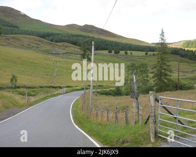 The very scenic A924 winds its way through the river valley of Strathardle with stunning moorland and glen scenery between Blairgowrie and Pitlochry. Stock Photo