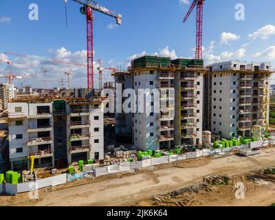 Aerial view at workers are working on large construction sites and many cranes are working Stock Photo