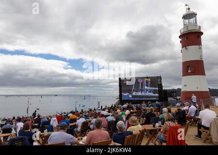 SailGP, Plymouth, UK. 31st July, 2022. The crowds enjoying the racing on Plymouth Hoe as Ben Ainslie and Team GB win the first race of Final day for the Great British Sail Grand Prix. Britain's Ocean City hosts the third event of Season 3 as the most competitive racing on water. The event returns to Plymouth on 30-31 July. Credit: Julian Kemp/Alamy Live News Stock Photo