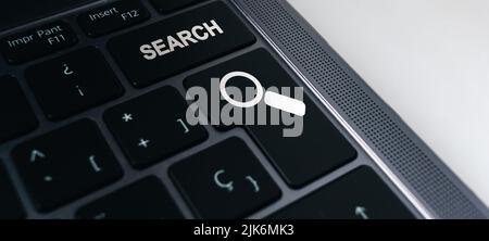 Banner of keyboard with search button and selective focus. Concept of searching browsing Internet data information. Stock Photo