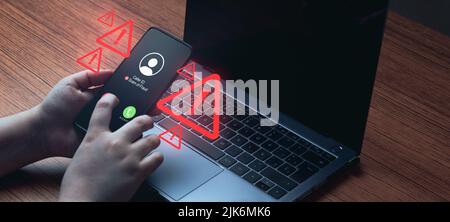 Banner of woman using laptop while receiving an unwanted call. Spam, scam, phishing and fraud concept. Security technology. Stock Photo