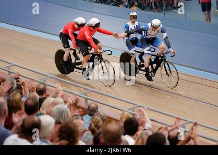 Wales’ James Ball and Matthew Rotherham are congratulated by Scotland’s Neil Fachie and Lewis Stewart after winning a Gold Medal during the Men’s Tandem B Sprint Finals at Lee Valley VeloPark on day three of the 2022 Commonwealth Games in London. Picture date: Sunday July 31, 2022. Stock Photo
