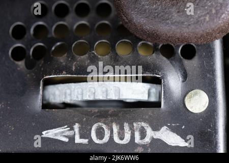 The volume knob on the bottom of an old rotary dial telephone. Stock Photo