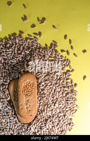 healthy cereal cookies with sunflower seeds on a yellow background Stock Photo