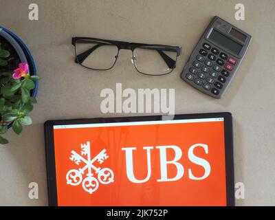 In this photo illustration, UBS Group AG logo seen displayed on a tablet Stock Photo