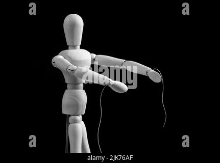 Puppet under manipulation control concept. High quality photo Stock Photo
