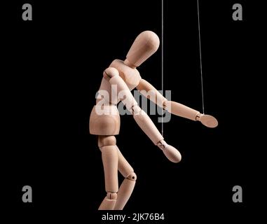 Puppet under manipulation control concept. High quality photo Stock Photo