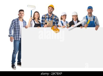 Portrait of happy construction workers holding blank banner isolated against white background Stock Photo