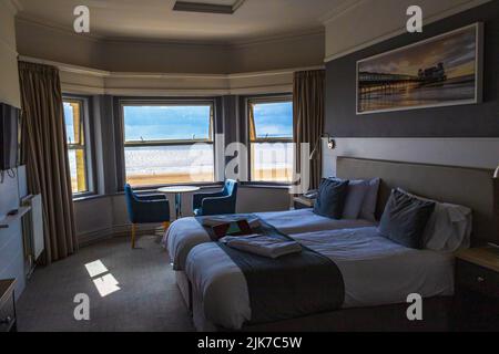 Scenic view from a hotel room at Beach Road at Weston-super-Mare - a seaside town in North Somerset, England. Stock Photo