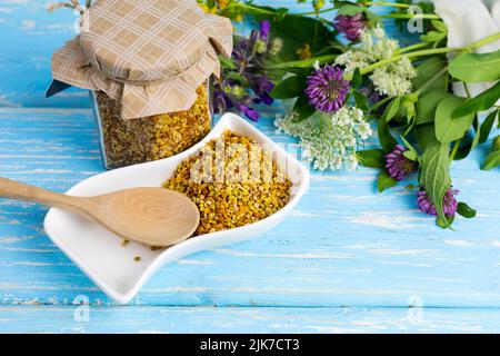 Bee pollen in a glass jar is a healthy diet. A product of beekeeping. Apitherapy. Stock Photo