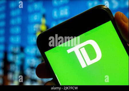 In this photo illustration, the Canadian multinational banking and financial services corporation Toronto Dominion Bank (TD) logo is displayed on a smartphone screen. (Photo by Budrul Chukrut / SOPA Images/Sipa USA) Stock Photo