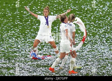 England's Rachel Daly, Millie Bright and Leah Williamson celebrate after winning the UEFA Women's Euro 2022 final at Wembley Stadium, London. Picture date: Sunday July 31, 2022. Stock Photo