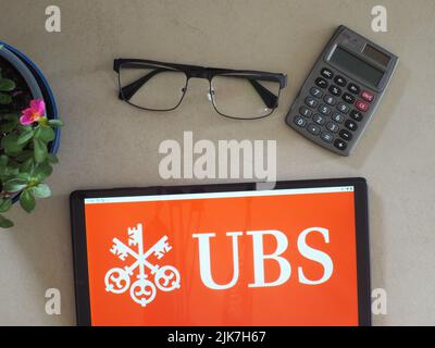 In this photo illustration, UBS Group AG logo seen displayed on a tablet. Stock Photo