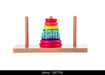 Wooden puzzle tower of hanoi with color rings isolated on white background. Toy for kids. Stock Photo