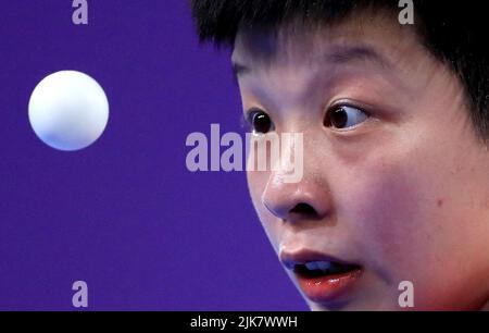 Singapore’s Jian Zeng serves with partner (out of frame) Jingyi Zhou against Australia’s Minhyung Jee and Jian Fang Lay during the Women's Table Tennis Team Semi-Final match between Singapore and Australia at The NEC on day three of the 2022 Commonwealth Games in Birmingham. Picture date: Sunday July 31, 2022. Stock Photo