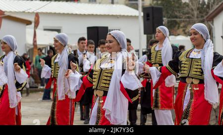 Turkish Cypriot female dancers in traditional costumes perform a dance routine at the Tepebasi tulip festival (Lale Festivali) in North Cyprus Stock Photo