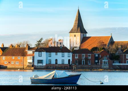 Bosham village viewed across the harbour on a sunny winter afternoon, Bosham, West Sussex, England Stock Photo