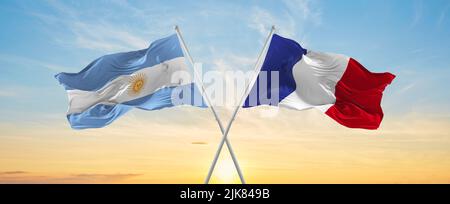 crossed national flags of France and Argentina flag waving in the wind ...