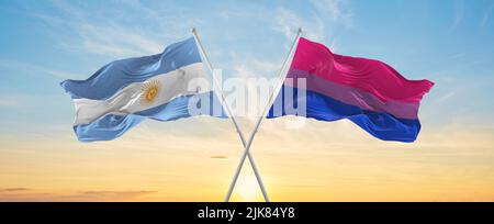 crossed national flags of Argentine and isexuality Pride flag waving in ...