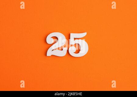 Number 25 - On orange foam rubber background Stock Photo