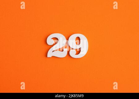 Number 29 - On orange foam rubber background Stock Photo