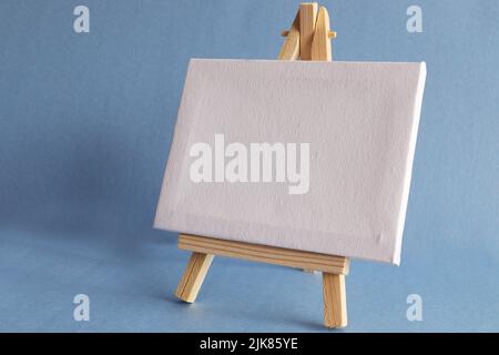 Blank miniature canvas on easel with large Copy Space Stock Photo