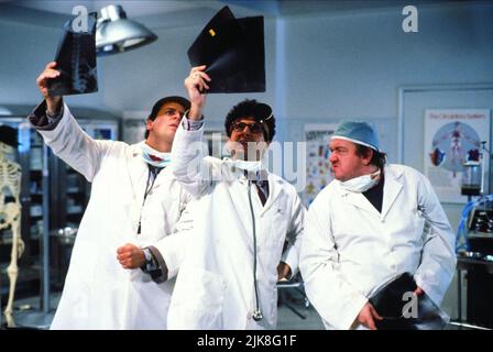 Bob Nelson, John Turturro & Mel Smith Film: Brain Donors (1992) Characters: Jacques, Roland T. Flakfizer, Rocco Melonchek  Director: Dennis Dugan 17 April 1992   **WARNING** This Photograph is for editorial use only and is the copyright of PARAMOUNT PICTURES and/or the Photographer assigned by the Film or Production Company and can only be reproduced by publications in conjunction with the promotion of the above Film. A Mandatory Credit To PARAMOUNT PICTURES is required. The Photographer should also be credited when known. No commercial use can be granted without written authority from the Fil Stock Photo