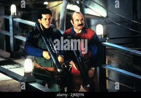 John Leguizamo & Bob Hoskins Film: Super Mario Bros. (1993) Characters: Luigi Mario & Mario Mario  Director: Annabel Jankel 28 May 1993   **WARNING** This Photograph is for editorial use only and is the copyright of ALLIED FILMMAKERS and/or the Photographer assigned by the Film or Production Company and can only be reproduced by publications in conjunction with the promotion of the above Film. A Mandatory Credit To ALLIED FILMMAKERS is required. The Photographer should also be credited when known. No commercial use can be granted without written authority from the Film Company. Stock Photo
