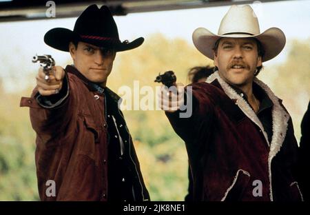 Woody Harrelson, Kiefer Sutherland Film: The Cowboy Way (1994) Characters: Pepper Lewis,Sonny Gilstrap  Director: Gregg Champion 03 June 1994   **WARNING** This Photograph is for editorial use only and is the copyright of UNIVERSAL and/or the Photographer assigned by the Film or Production Company and can only be reproduced by publications in conjunction with the promotion of the above Film. A Mandatory Credit To UNIVERSAL is required. The Photographer should also be credited when known. No commercial use can be granted without written authority from the Film Company. Stock Photo