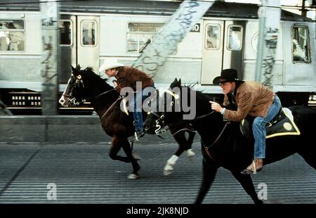 Kiefer Sutherland, Woody Harrelson Film: The Cowboy Way (1994) Characters: Sonny Gilstrap,Pepper Lewis  Director: Gregg Champion 03 June 1994   **WARNING** This Photograph is for editorial use only and is the copyright of UNIVERSAL and/or the Photographer assigned by the Film or Production Company and can only be reproduced by publications in conjunction with the promotion of the above Film. A Mandatory Credit To UNIVERSAL is required. The Photographer should also be credited when known. No commercial use can be granted without written authority from the Film Company. Stock Photo