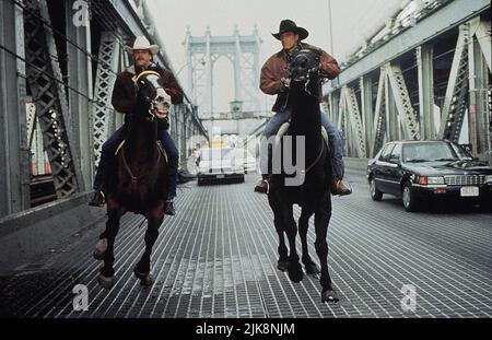 Kiefer Sutherland, Woody Harrelson Film: The Cowboy Way (1994) Characters: Sonny Gilstrap,Pepper Lewis  Director: Gregg Champion 03 June 1994   **WARNING** This Photograph is for editorial use only and is the copyright of UNIVERSAL and/or the Photographer assigned by the Film or Production Company and can only be reproduced by publications in conjunction with the promotion of the above Film. A Mandatory Credit To UNIVERSAL is required. The Photographer should also be credited when known. No commercial use can be granted without written authority from the Film Company. Stock Photo