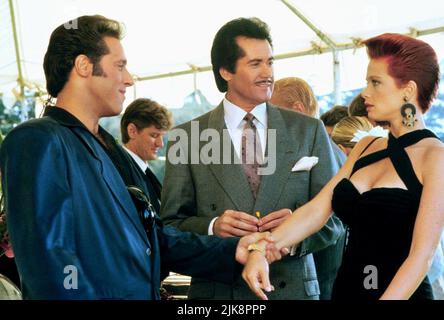 Andrew Dice Clay, Wayne Newton, Lauren Holly Film: Adventures Of Ford Fairlane (1990) Characters: Ford Fairlane,Julian Grendel,Jazz  Director: Renny Harlin 11 July 1990   **WARNING** This Photograph is for editorial use only and is the copyright of 20 CENTURY FOX and/or the Photographer assigned by the Film or Production Company and can only be reproduced by publications in conjunction with the promotion of the above Film. A Mandatory Credit To 20 CENTURY FOX is required. The Photographer should also be credited when known. No commercial use can be granted without written authority from the Fi Stock Photo