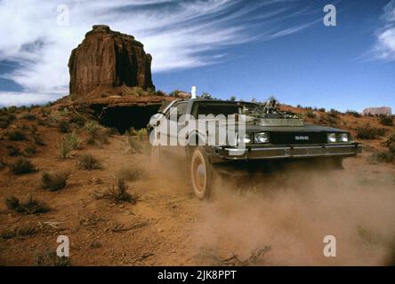 Delorean Dmc-12 Film: Back To The Future Part Iii; Back To The Future Part 3 (USA 1990)   / Location: Monument Valley, Utah, Usa Director: Robert Zemeckis 25 May 1990   **WARNING** This Photograph is for editorial use only and is the copyright of UNIVERSAL and/or the Photographer assigned by the Film or Production Company and can only be reproduced by publications in conjunction with the promotion of the above Film. A Mandatory Credit To UNIVERSAL is required. The Photographer should also be credited when known. No commercial use can be granted without written authority from the Film Company. Stock Photo