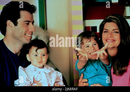 John Travolta, Megan Milner, Lorne Sussman, Kirstie Alley Film: Look Who'S Talking Too (USA 1990) Characters: James Ubriacco,Julie Ubriacco - 1 Year,Mikey Ubriacco,Mollie Ubriacco  Director: Amy Heckerling 14 December 1990   **WARNING** This Photograph is for editorial use only and is the copyright of TRISTAR PICTURES and/or the Photographer assigned by the Film or Production Company and can only be reproduced by publications in conjunction with the promotion of the above Film. A Mandatory Credit To TRISTAR PICTURES is required. The Photographer should also be credited when known. No commercia Stock Photo