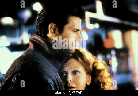Lorenzo Lamas & Arlene Dahl  Film Night Of The Warrior (1990) Characters: Miles Keane & Edie Keane  Director: Rafal Zielinski 16 October 1991   **WARNING** This Photograph is for editorial use only and is the copyright of TRIMARK and/or the Photographer assigned by the  Film or Production Company and can only be reproduced by publications in conjunction with the promotion of the above  Film. A Mandatory Credit To TRIMARK is required. The Photographer should also be credited when known. No commercial use can be granted without written authority from the  Film Company. Stock Photo