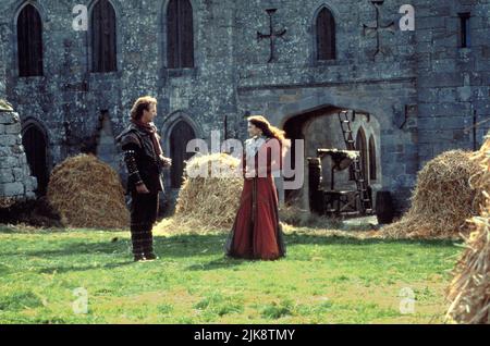 Kevin Costner & Mary Elizabeth Mastrantonio Film: Robin Hood: Prince Of Thieves (USA 1991) Characters: Robin Hood & Marian Dubois  Director: Kevin Reynolds 14 June 1991   **WARNING** This Photograph is for editorial use only and is the copyright of WARNER BROS. and/or the Photographer assigned by the Film or Production Company and can only be reproduced by publications in conjunction with the promotion of the above Film. A Mandatory Credit To WARNER BROS. is required. The Photographer should also be credited when known. No commercial use can be granted without written authority from the Film C Stock Photo