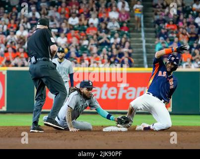 Houston Astros Yuli Gurriel (L) scores against New York Yankees catcher  Gary Sanchez in the fifth inning on a double by teammate Brian McCan in  game 7 of the American League Championship