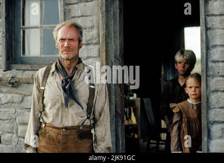 Clint Eastwood, Shane Meier & Aline Levasseur Film: Unforgiven (USA 1992) Characters: William 'Bill' Munny, Will Munny (Jr.), Penny Munny  Director: Clint Eastwood 03 August 1992   **WARNING** This Photograph is for editorial use only and is the copyright of WARNER BROS. and/or the Photographer assigned by the Film or Production Company and can only be reproduced by publications in conjunction with the promotion of the above Film. A Mandatory Credit To WARNER BROS. is required. The Photographer should also be credited when known. No commercial use can be granted without written authority from Stock Photo