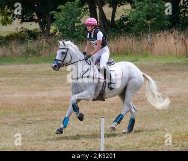 East Budleigh Salterton, United Kingdom, 31 Jul, 2022, Ellouise Bragg riding Bloomfield Tiger Two during the Cross-Country section at Bicton Horse Trials. Credit: Will Tudor/Alamy Live News Stock Photo