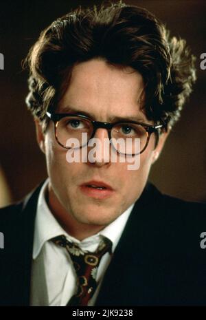 Hugh Grant Film: Four Weddings And A Funeral (UK 1994) Characters: Charles  Director: Mike Newell 20 January 1994   **WARNING** This Photograph is for editorial use only and is the copyright of WORKING TITLE FILMS and/or the Photographer assigned by the Film or Production Company and can only be reproduced by publications in conjunction with the promotion of the above Film. A Mandatory Credit To WORKING TITLE FILMS is required. The Photographer should also be credited when known. No commercial use can be granted without written authority from the Film Company. Stock Photo