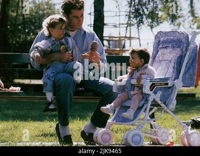 John Travolta, Megan Milner & Lorne Sussman Film: Look Who'S Talking Too (USA 1990) Characters: James Ubriacco,Julie Ubriacco - 1 Year & Mikey Ubriacco  Director: Amy Heckerling 14 December 1990   **WARNING** This Photograph is for editorial use only and is the copyright of TRISTAR PICTURES and/or the Photographer assigned by the Film or Production Company and can only be reproduced by publications in conjunction with the promotion of the above Film. A Mandatory Credit To TRISTAR PICTURES is required. The Photographer should also be credited when known. No commercial use can be granted without Stock Photo