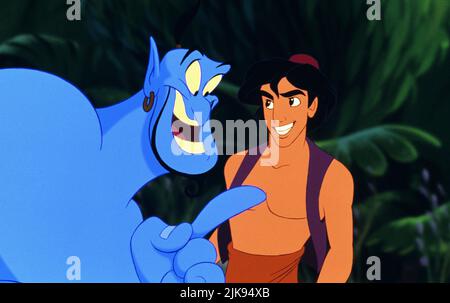 The Genie & Aladdin Film: Aladdin (USA 1992) Characters: Genie &  Director: Ron Clements & John Musker 08 November 1992   **WARNING** This Photograph is for editorial use only and is the copyright of WALT DISNEY PICTURES and/or the Photographer assigned by the Film or Production Company and can only be reproduced by publications in conjunction with the promotion of the above Film. A Mandatory Credit To WALT DISNEY PICTURES is required. The Photographer should also be credited when known. No commercial use can be granted without written authority from the Film Company. Stock Photo