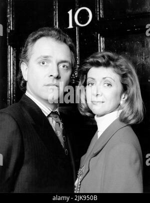 Rik Mayall & Marsha Fitzalan Television: The New Statesman (1991) Characters: Alan B'Stard & Sarah B'Stard  Director: Laurence Marks, Maurice Gran 13 January 1991   **WARNING** This Photograph is for editorial use only and is the copyright of YORKSHIRE TELEVISION and/or the Photographer assigned by the Film or Production Company and can only be reproduced by publications in conjunction with the promotion of the above Film. A Mandatory Credit To YORKSHIRE TELEVISION is required. The Photographer should also be credited when known. No commercial use can be granted without written authority from Stock Photo