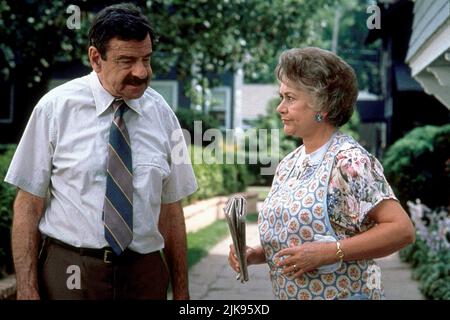 Walter Matthau & Joan Plowright Film: Dennis The Menace (1993) Characters: Mr. George Wilson & Mrs. Martha Wilson  Director: Nick Castle 25 June 1993   **WARNING** This Photograph is for editorial use only and is the copyright of WARNER BROS and/or the Photographer assigned by the Film or Production Company and can only be reproduced by publications in conjunction with the promotion of the above Film. A Mandatory Credit To WARNER BROS is required. The Photographer should also be credited when known. No commercial use can be granted without written authority from the Film Company. Stock Photo