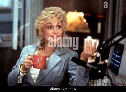 Dolly Parton Film: Straight Talk (USA 1992) Characters: Shirlee Kenyon  Director: Barnet Kellman 03 April 1992   **WARNING** This Photograph is for editorial use only and is the copyright of BUENA VISTA PICTURES and/or the Photographer assigned by the Film or Production Company and can only be reproduced by publications in conjunction with the promotion of the above Film. A Mandatory Credit To BUENA VISTA PICTURES is required. The Photographer should also be credited when known. No commercial use can be granted without written authority from the Film Company. Stock Photo